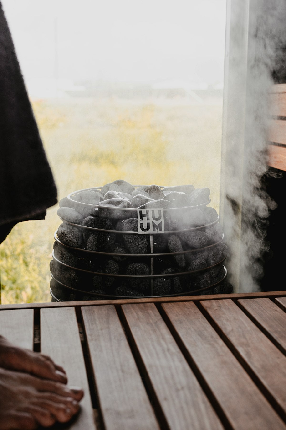 Steamy sauna with hot rocks and ambient lighting