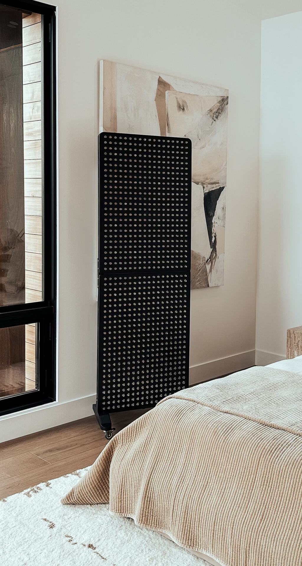 Renew Max Panel standing beside a bed