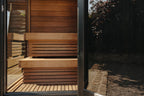 Thermasol Nordic Misty sauna interior, aspen benches seen through the glass door
