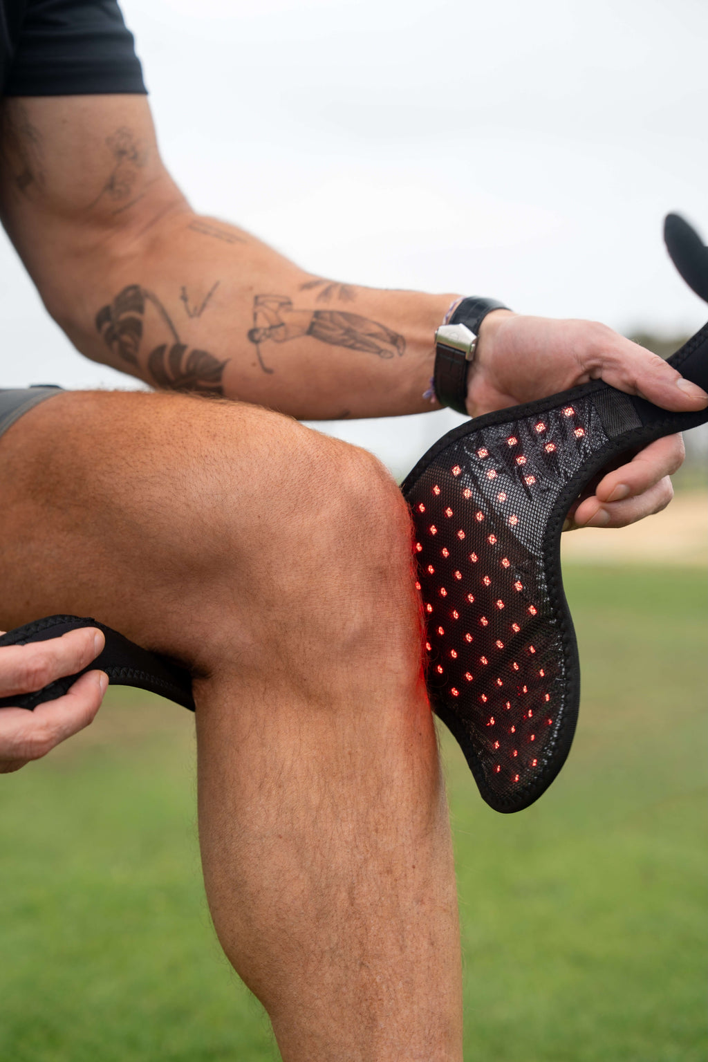 Renew Red Light Wrap being positioned around a knee
