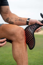 Renew Red Light Wrap being positioned around a knee