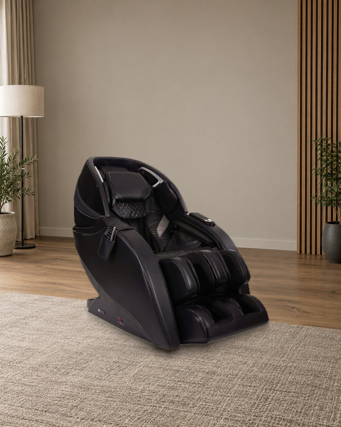 Infinity Evo Max 4D in Black in a softly lit media room (illustrative room, real chair photograph)