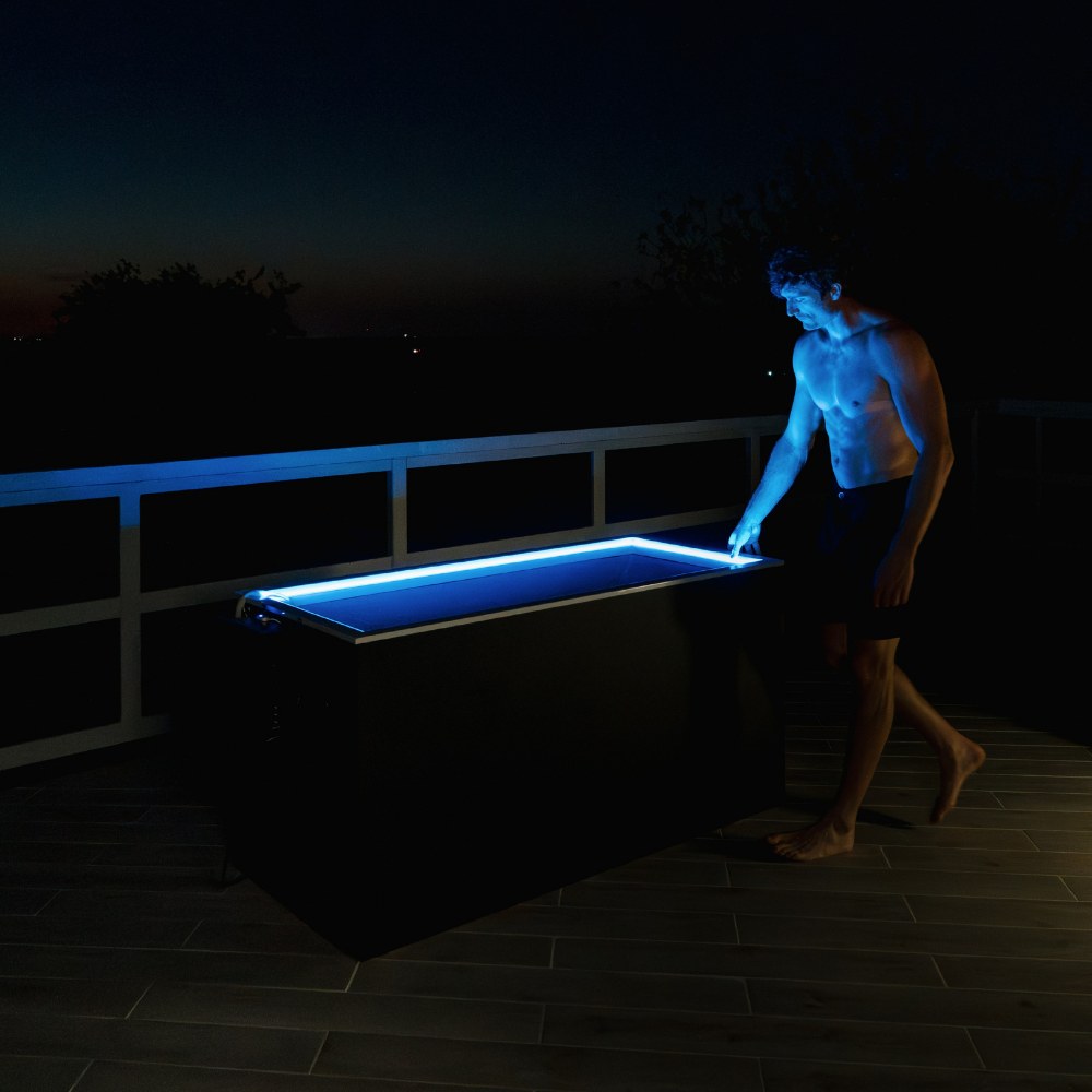 Plunge Zero Residential in Matte Black illuminated at night.
