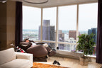 Infinity Smart Chair X3 in a penthouse living room, wide view