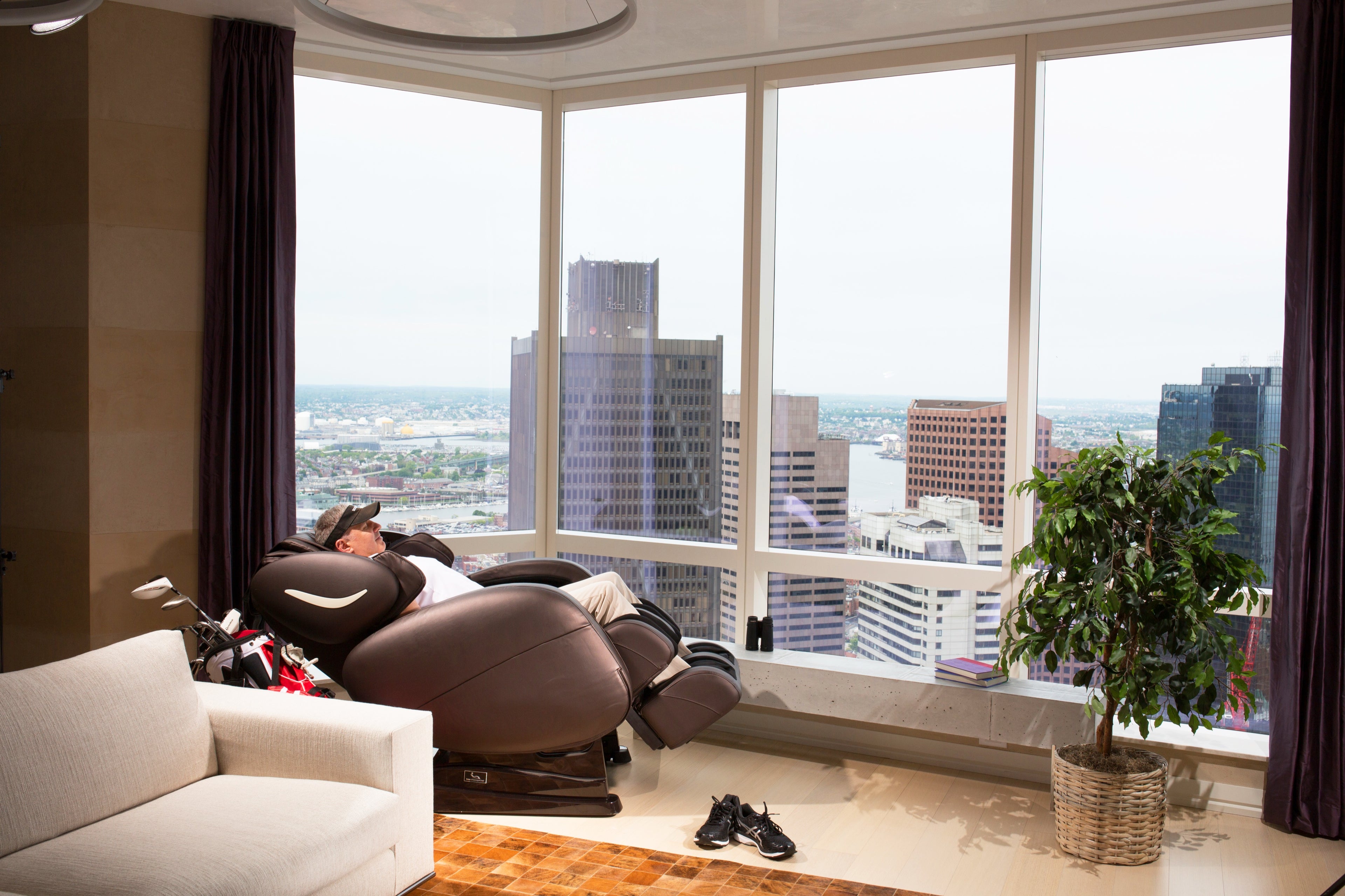 Infinity Smart Chair X3 in a penthouse living room, wide view